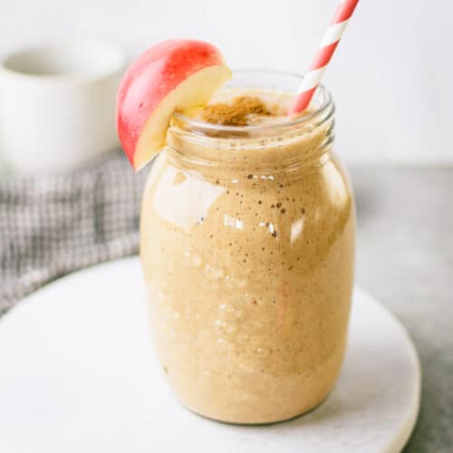 Close-up of a apple pie smoothie in a glas jar.