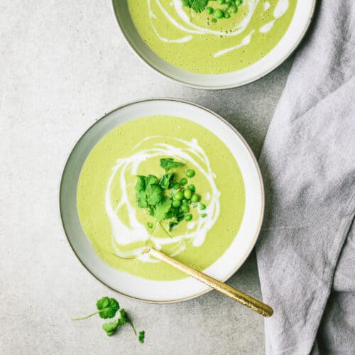 Creamy green pea soup in a bowl.