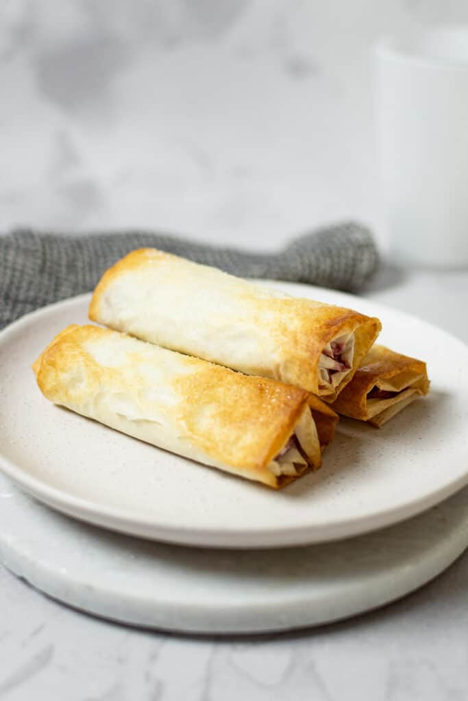 phyllo dough rolls on a white plate