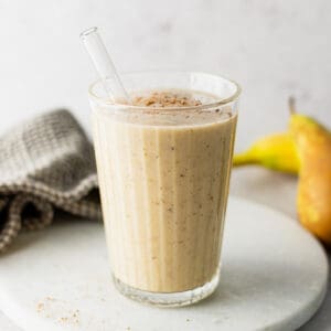 A glass of banana and pear smoothie.
