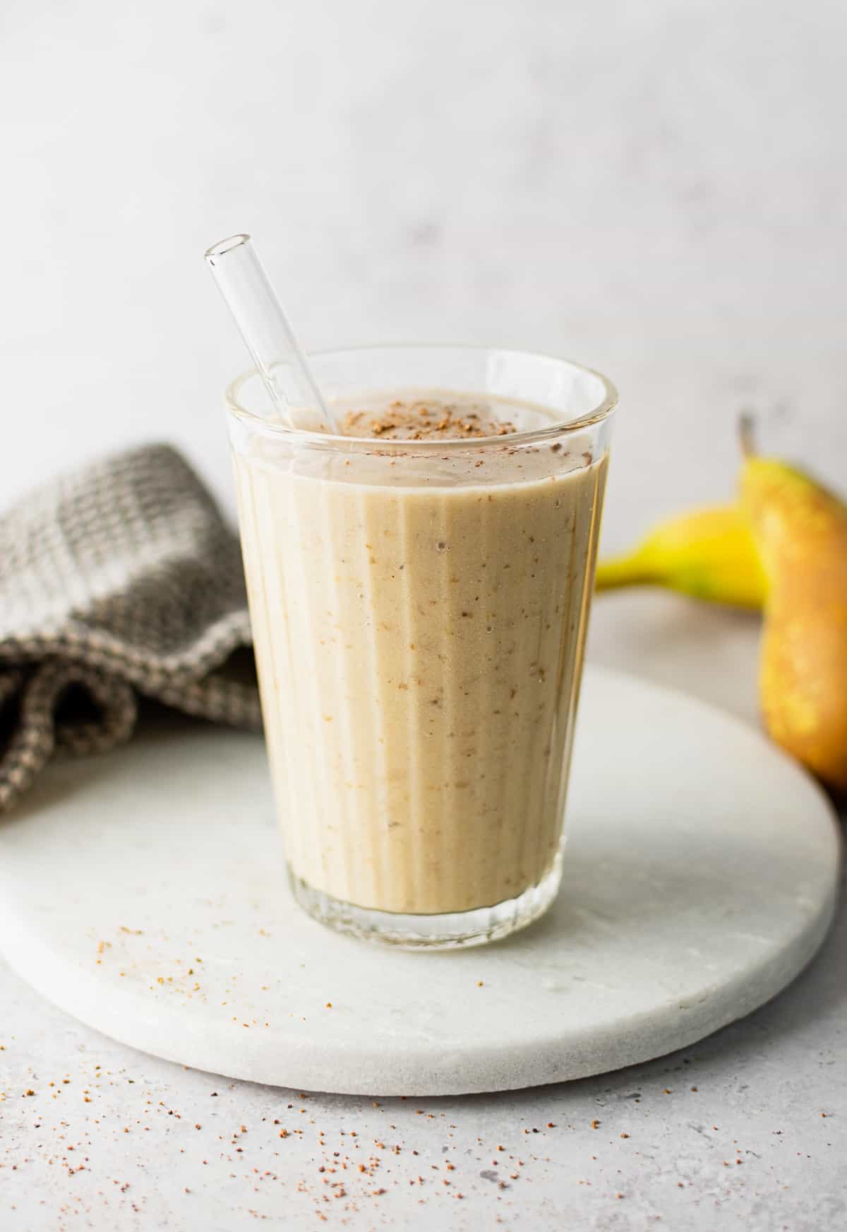 A glass of pear banana smoothie.